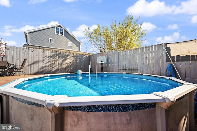 view of swimming pool featuring a fenced in pool and a fenced backyard