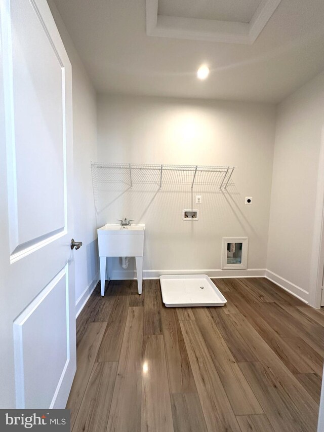 laundry room with baseboards, washer hookup, laundry area, wood finished floors, and hookup for an electric dryer