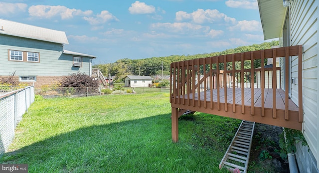 view of yard featuring an outbuilding and a deck