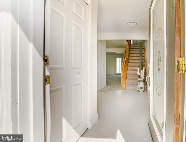 view of carpeted foyer entrance