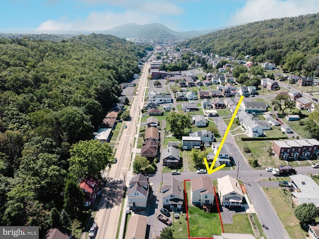 bird's eye view with a forest view, a mountain view, and a residential view