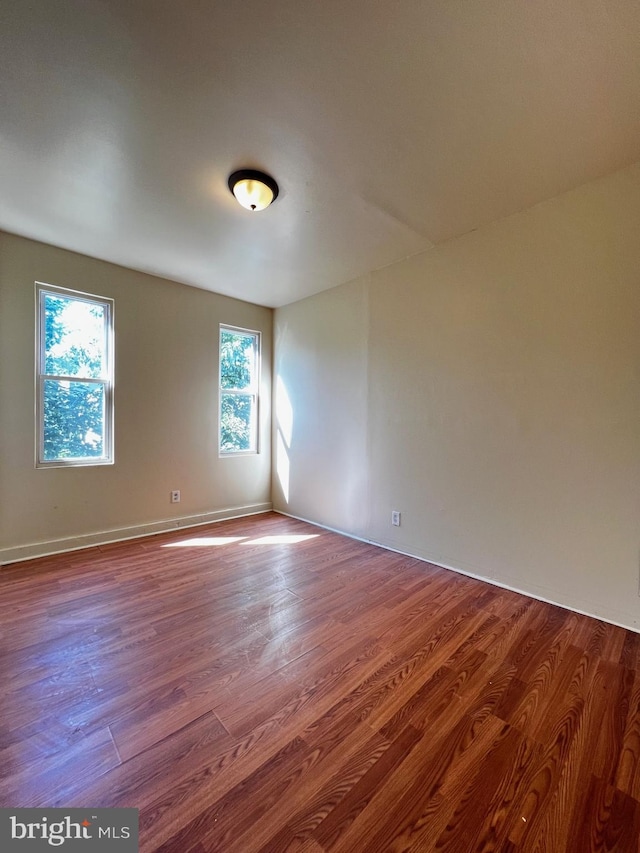 spare room featuring hardwood / wood-style flooring