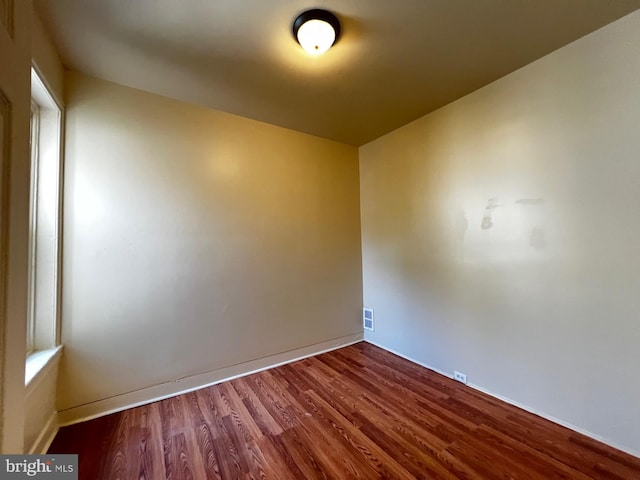 empty room featuring hardwood / wood-style flooring