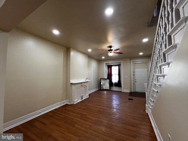 interior space with dark hardwood / wood-style flooring and ceiling fan