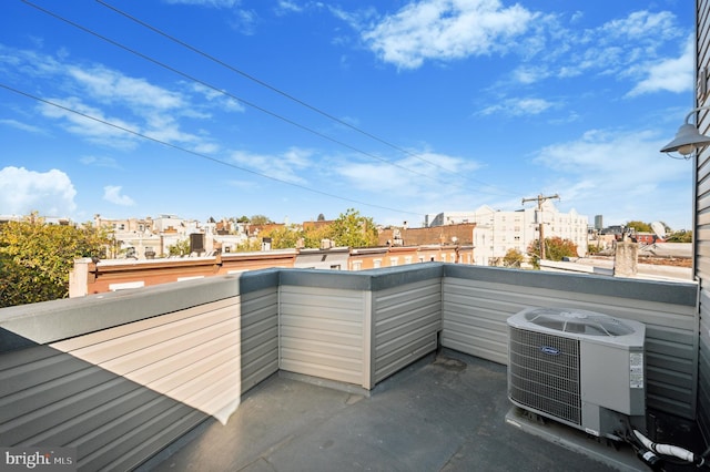 view of patio / terrace with central air condition unit and a balcony