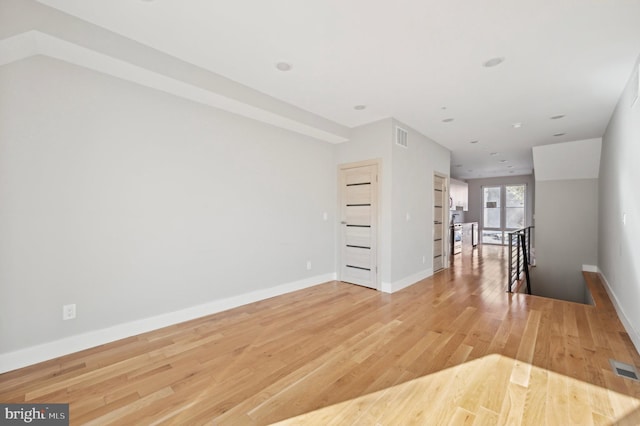 spare room with light wood-type flooring