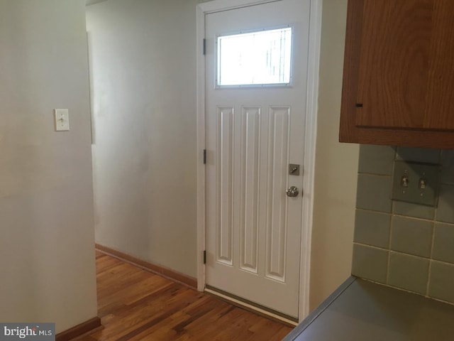 entryway with hardwood / wood-style flooring