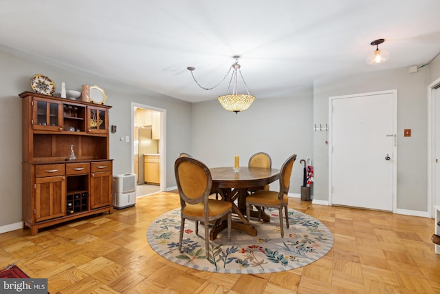 dining room featuring light parquet floors