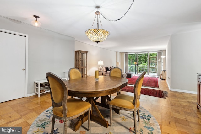 dining space with light parquet floors