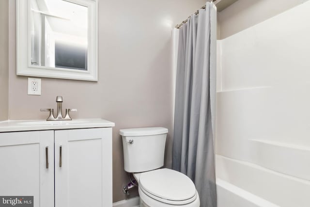 full bathroom featuring toilet, vanity, and shower / tub combo