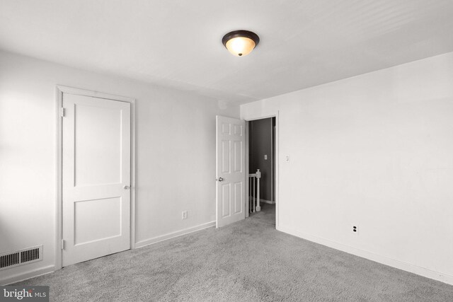 bathroom featuring vanity, walk in shower, a skylight, hardwood / wood-style flooring, and toilet