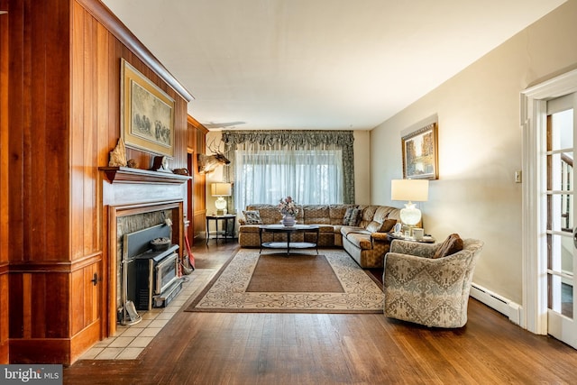 living room with light wood-type flooring and a baseboard radiator