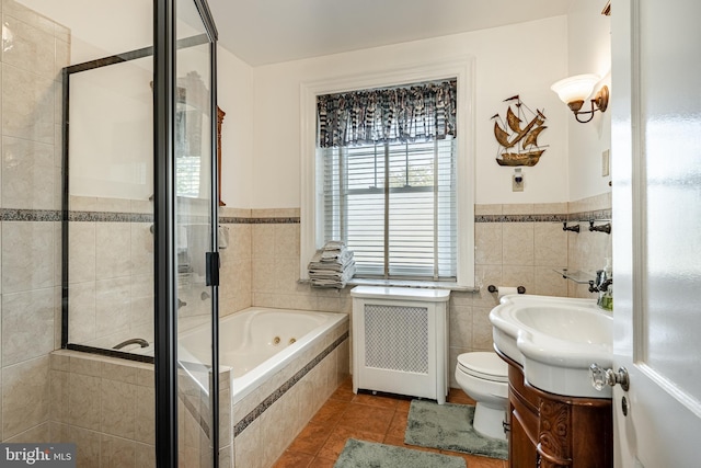 full bathroom with toilet, plus walk in shower, tile patterned floors, vanity, and radiator heating unit