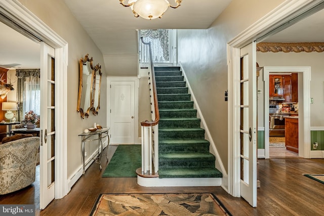 stairs featuring wood-type flooring