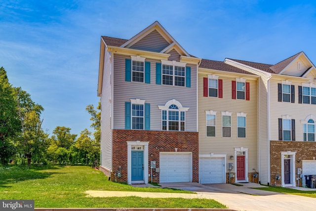 multi unit property featuring a garage and a front lawn