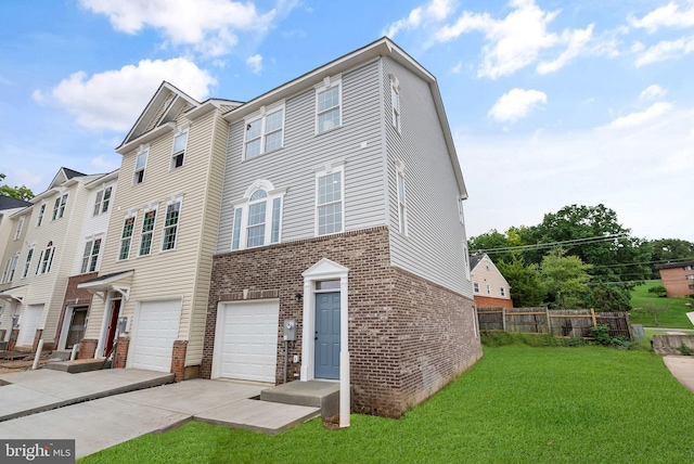 view of front of house with a front yard, fence, driveway, a garage, and brick siding