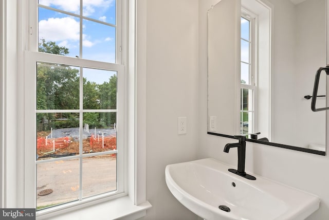 bathroom featuring sink and a healthy amount of sunlight