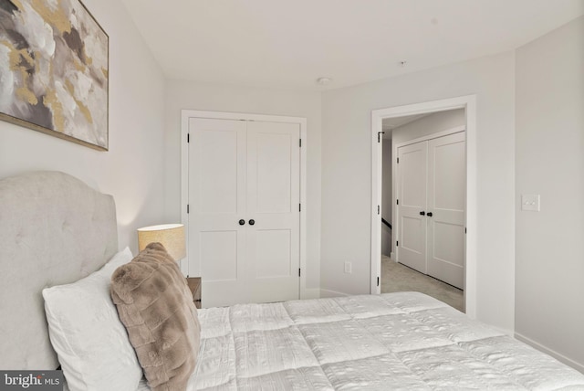 carpeted bedroom with a closet