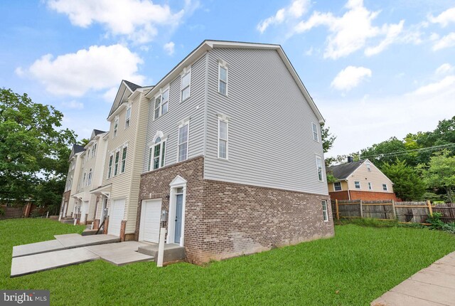 rear view of house featuring a yard, central AC, and a wooden deck