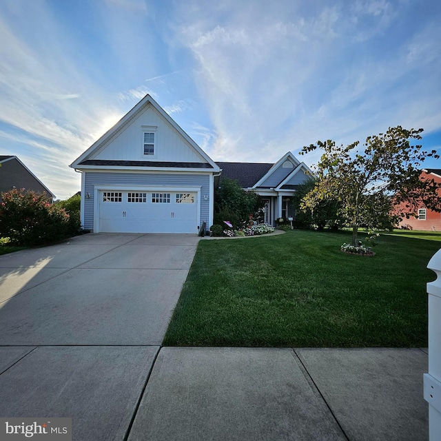 view of front facade with a garage and a front yard