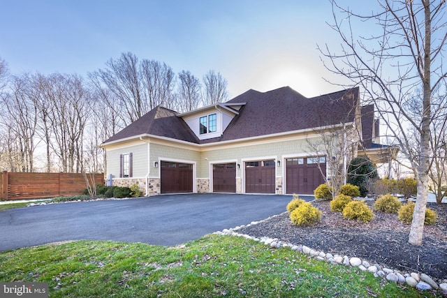 property exterior at dusk with a garage