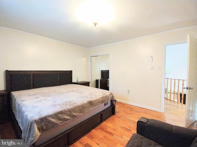 bedroom featuring light hardwood / wood-style flooring and a closet