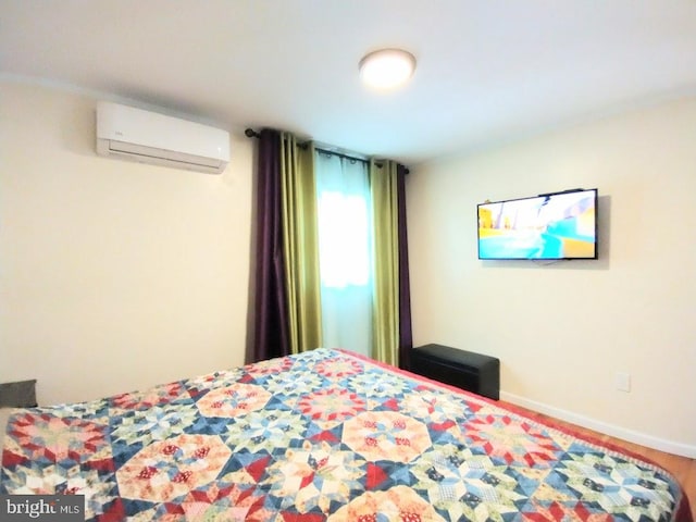 bedroom featuring a wall mounted AC