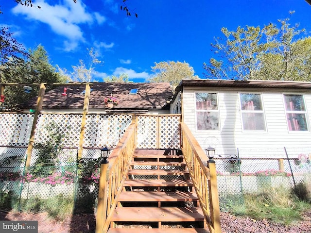 exterior space featuring a wooden deck