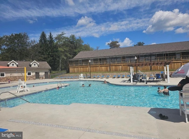 view of swimming pool featuring a patio