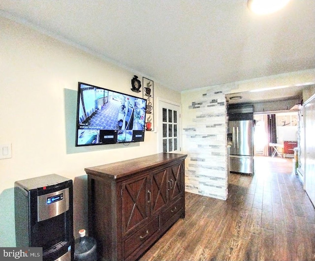 hall with dark wood-type flooring and a textured ceiling