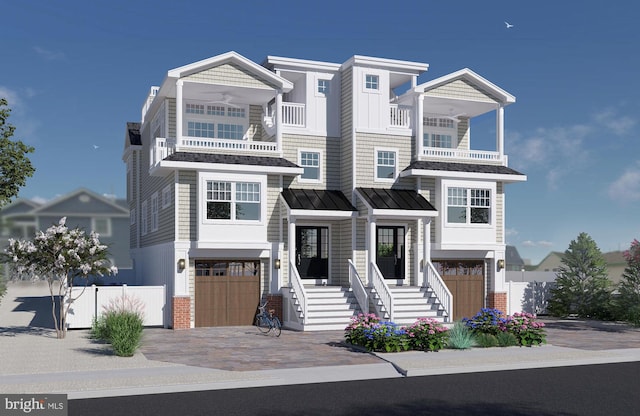 view of front of house with a balcony and a garage