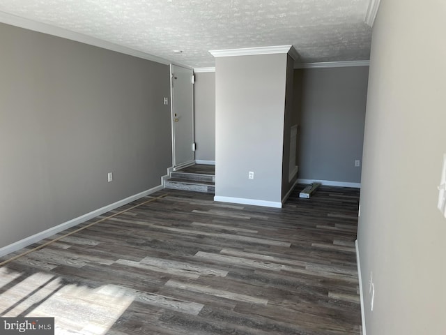 unfurnished room with dark hardwood / wood-style flooring, crown molding, and a textured ceiling