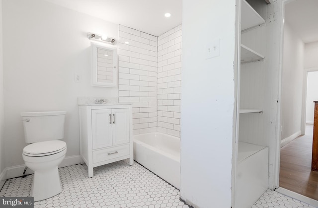 bathroom with vanity, toilet, and wood-type flooring