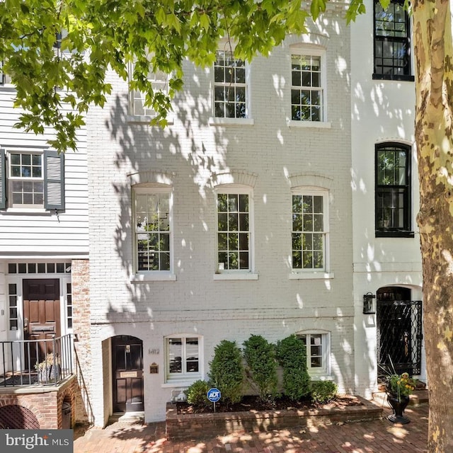 view of front of home featuring brick siding