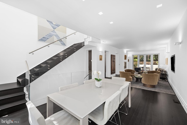dining space featuring stairs, dark wood-type flooring, french doors, and baseboards