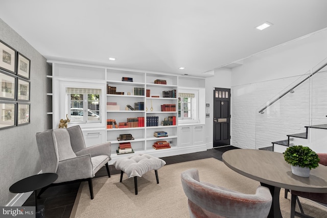 sitting room with stairs and recessed lighting