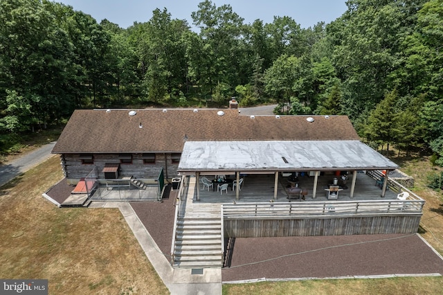 rear view of property with a deck