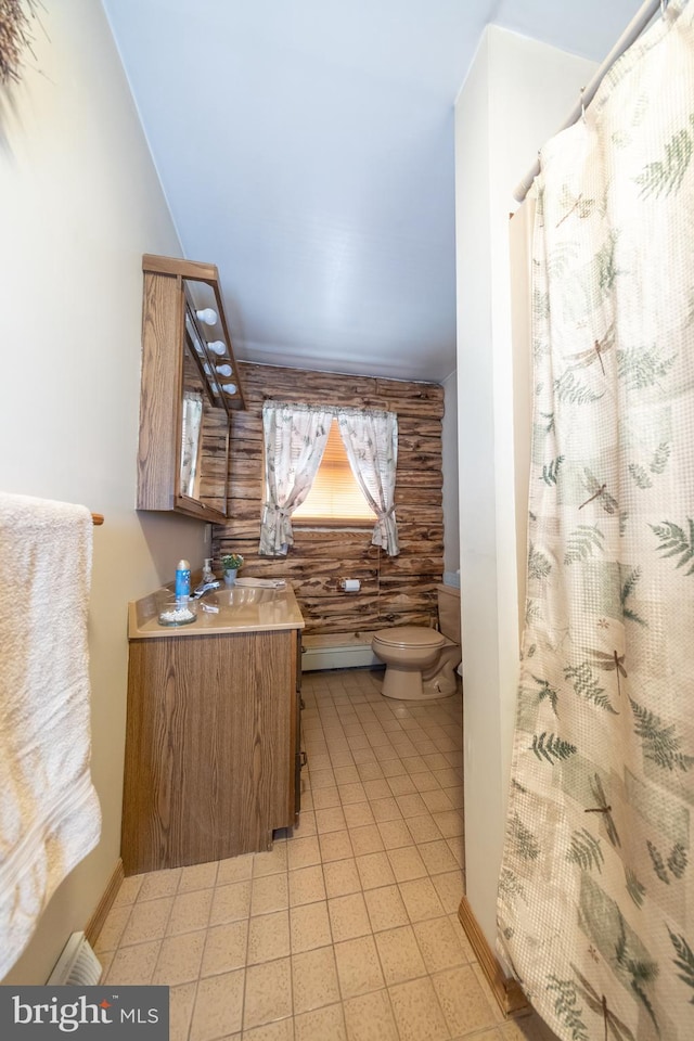 bathroom with tile patterned flooring, vanity, and toilet