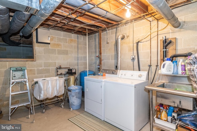 clothes washing area featuring independent washer and dryer