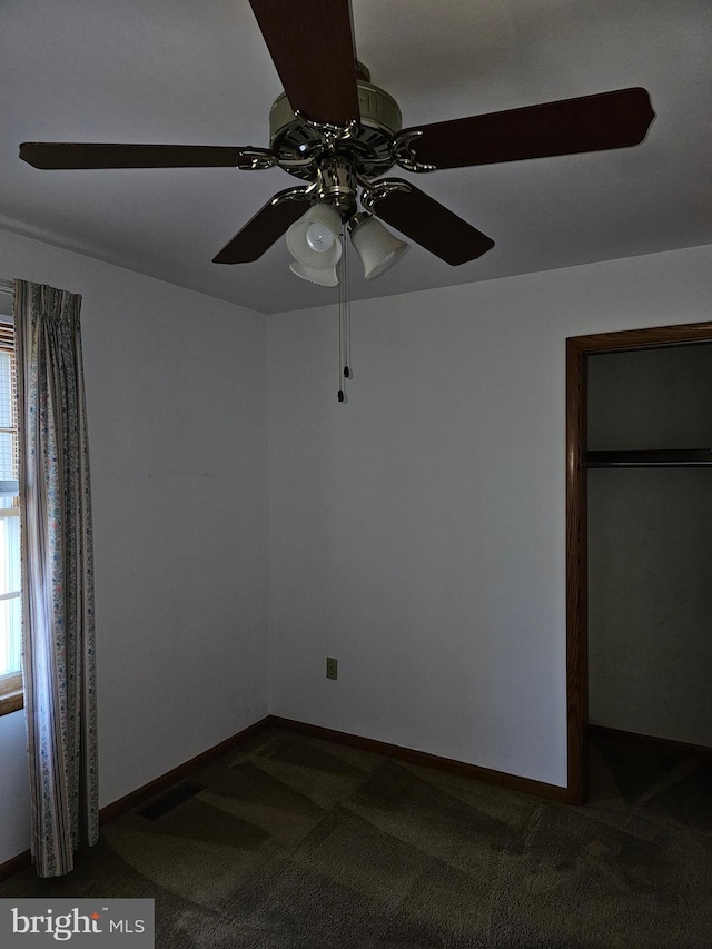 carpeted empty room with ceiling fan