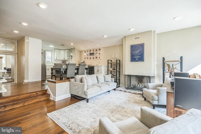 living room featuring wine cooler and hardwood / wood-style flooring