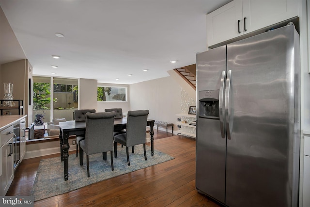 dining area with dark hardwood / wood-style floors