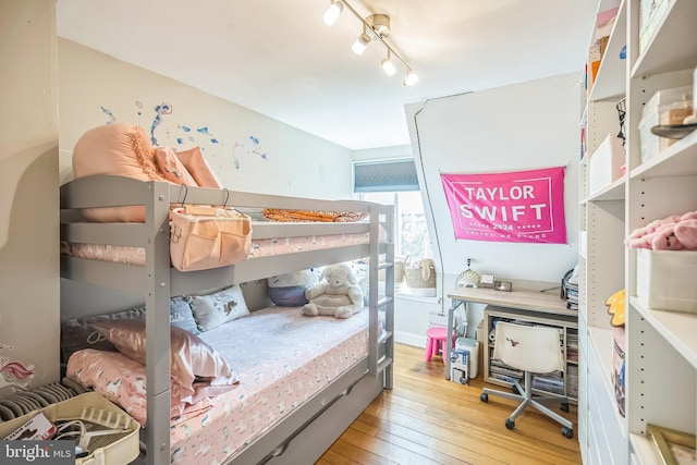 bedroom with light hardwood / wood-style floors