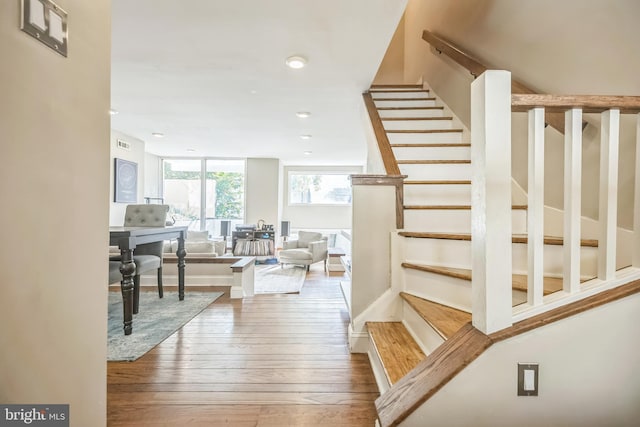 stairway featuring wood-type flooring