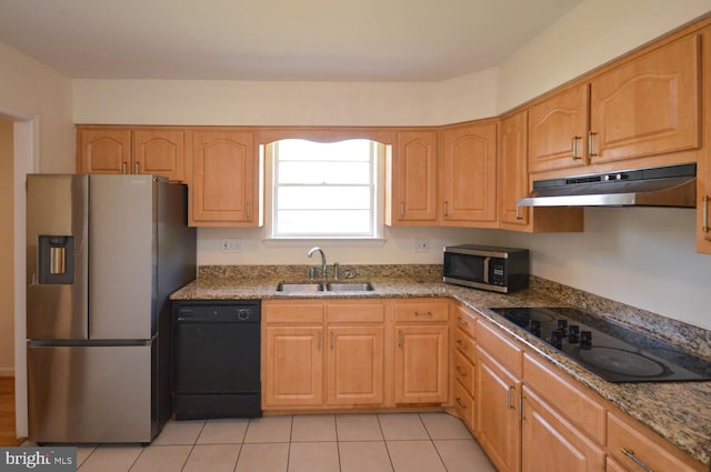 kitchen with light stone countertops, black appliances, light tile patterned floors, sink, and light brown cabinets