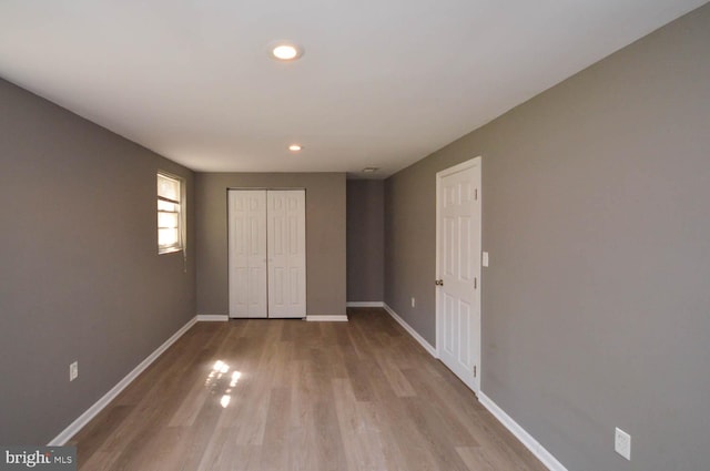 empty room with light hardwood / wood-style floors