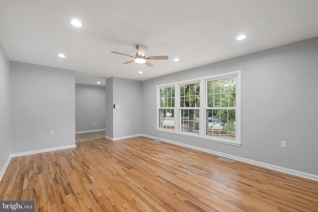 unfurnished room featuring light hardwood / wood-style floors and ceiling fan