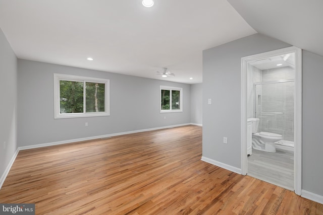 unfurnished room with ceiling fan, lofted ceiling, and light hardwood / wood-style floors