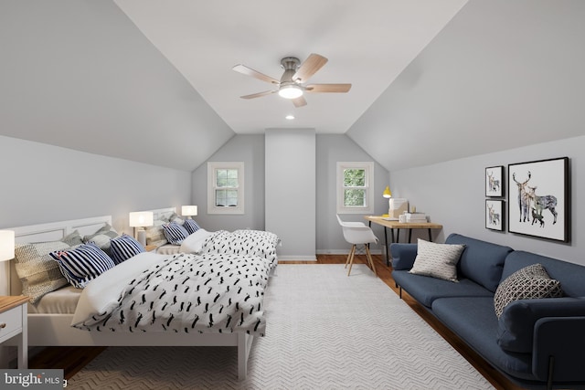 bedroom featuring lofted ceiling, ceiling fan, and hardwood / wood-style flooring