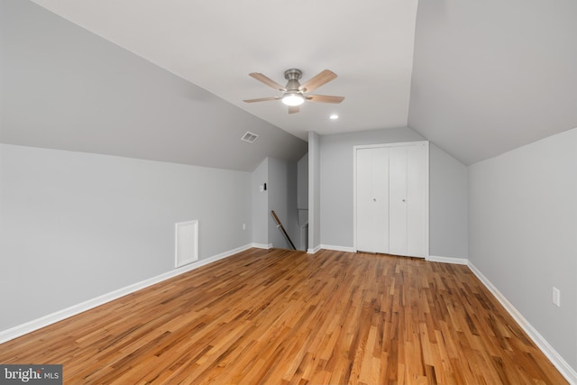 additional living space with ceiling fan, lofted ceiling, and light hardwood / wood-style floors